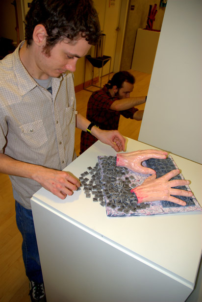 Matthew Pfliiger, "Drain Me," 2010, mixed media, cardboard, gesso, spackle, paper, acrylic.