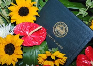 a diploma and flowers