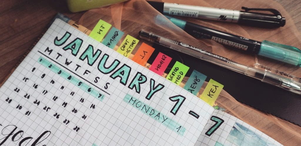 Planner/calendar and writing utensils.