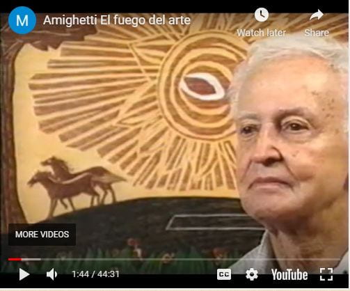 Older white male (Mr. Amighetti, right) in front of a woodblock print of horses, the sun, and a tree