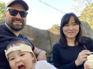 Chris, Jiyoon, and their son enjoying a break at the STL Zoo