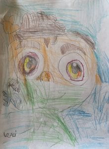 A child's portrait in colored pencil. 