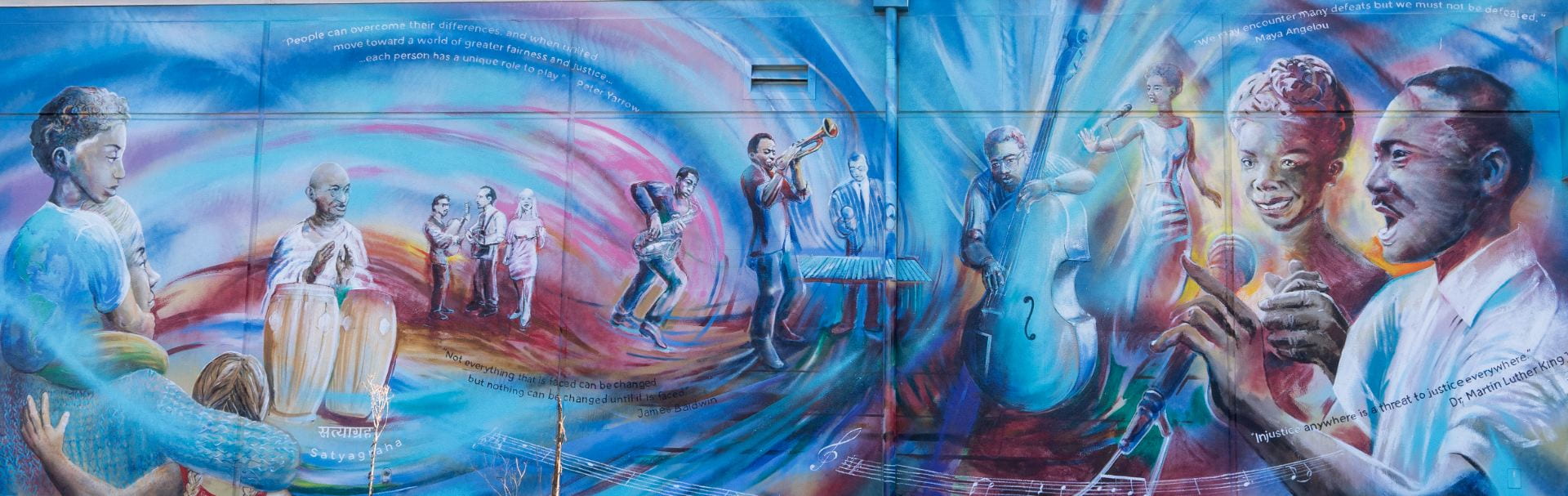 Painted mural that features Coleman in the middle playing jazz music with icons like Ella Fitzgerald and Dr. Martin Luther King, Jr surrounding him.