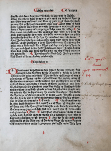 Printed leaf in Gothic face with initials and paragraphs added by hand in red ink.
