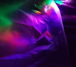 Colored lights play on a translucent plastic bag.