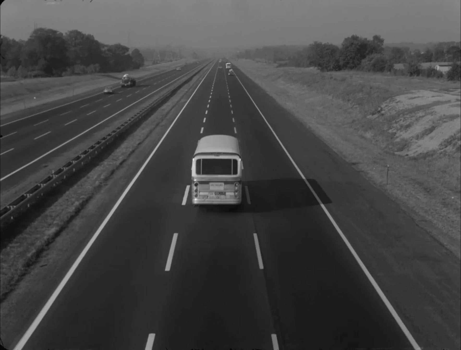 A bus drives on a highway.